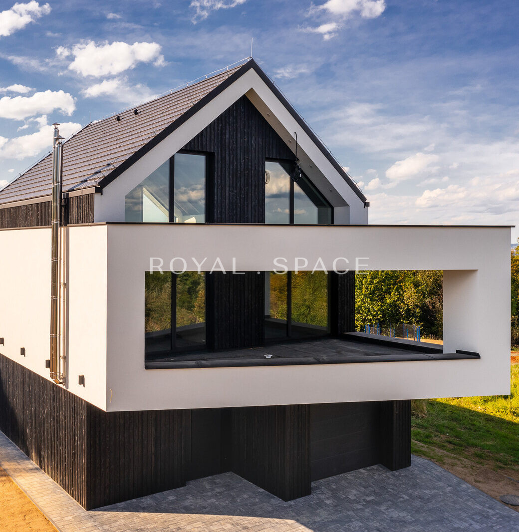 A modern house with large glazing on a hill!