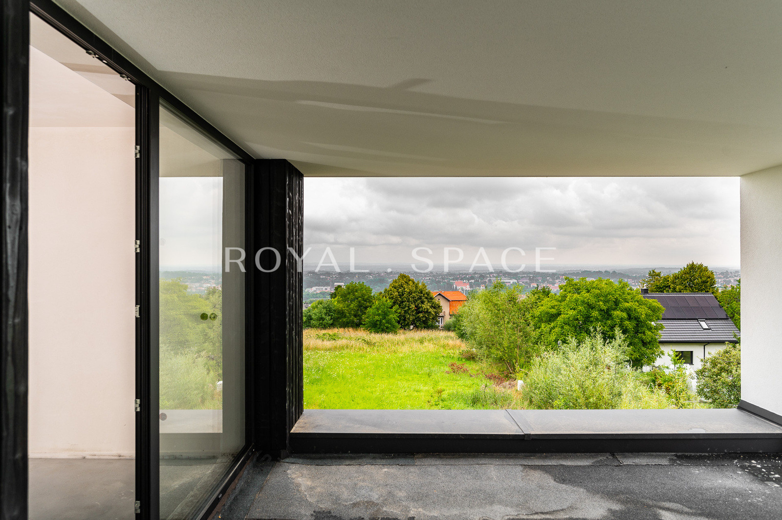 A modern house with large glazing on a hill!