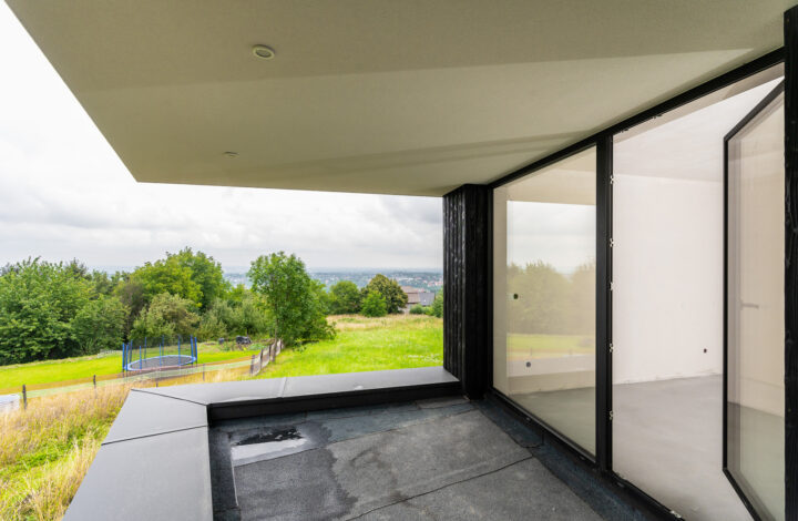 A modern house with large glazing on a hill!