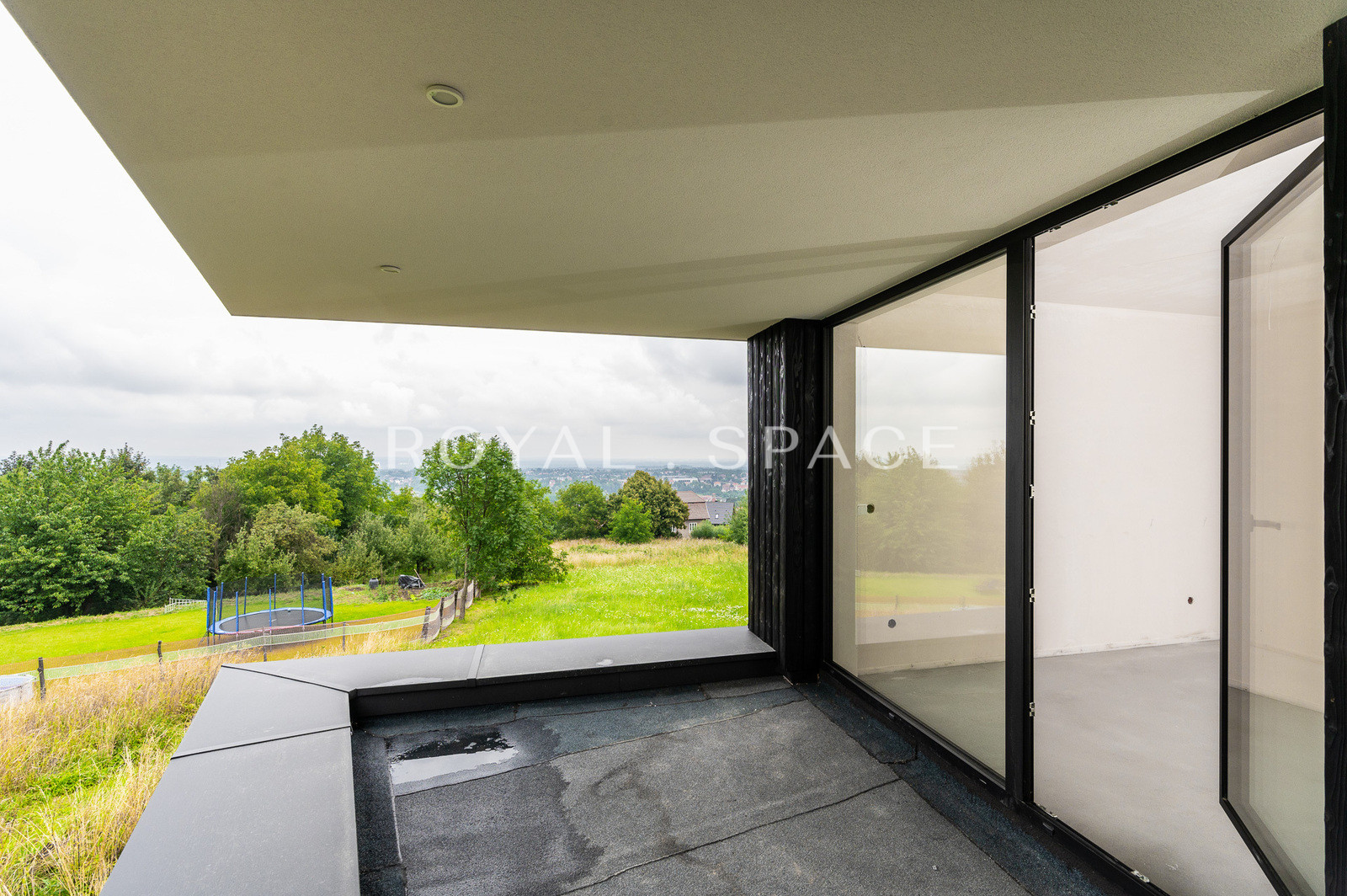A modern house with large glazing on a hill!