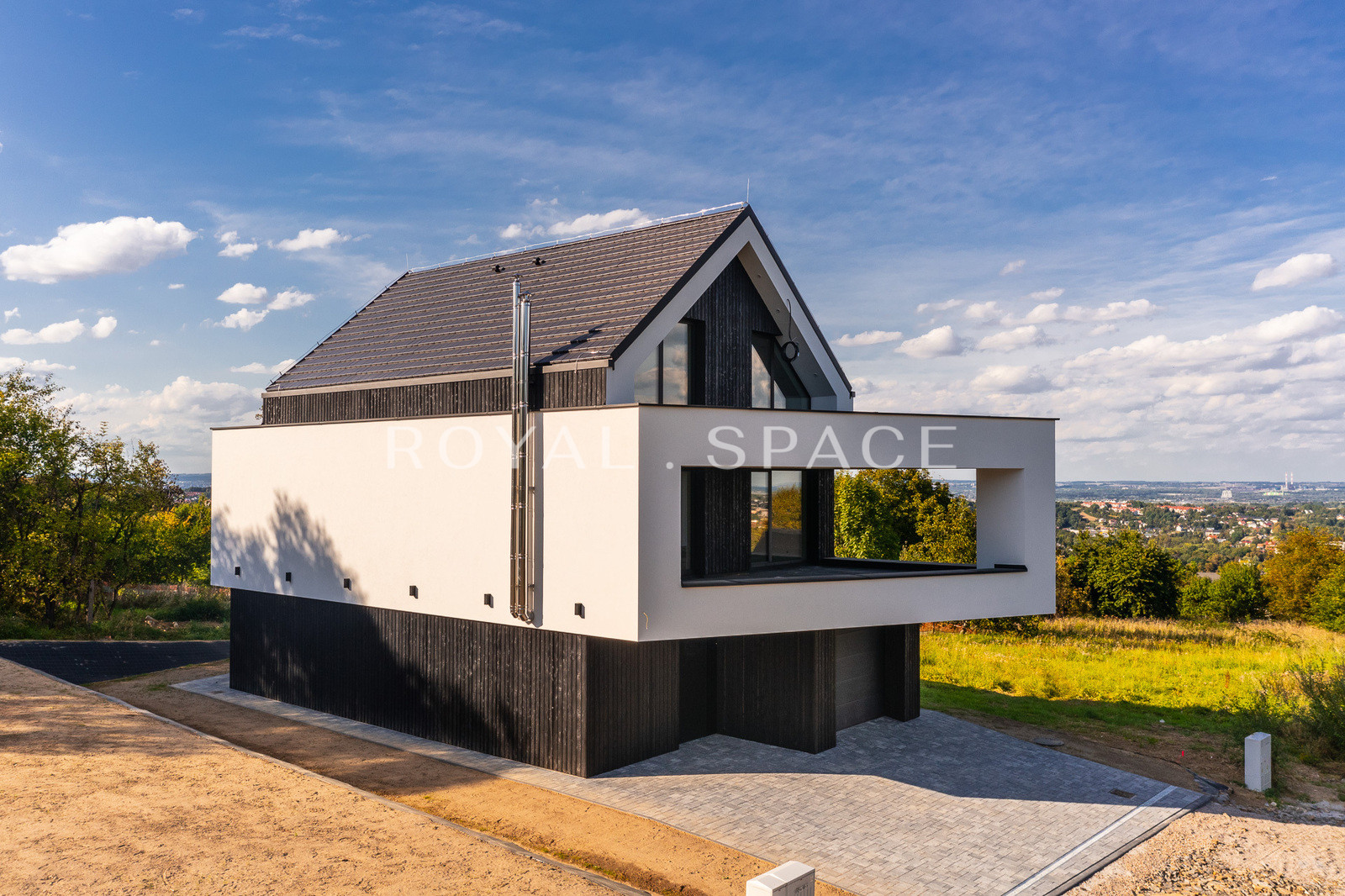 A modern house with large glazing on a hill!