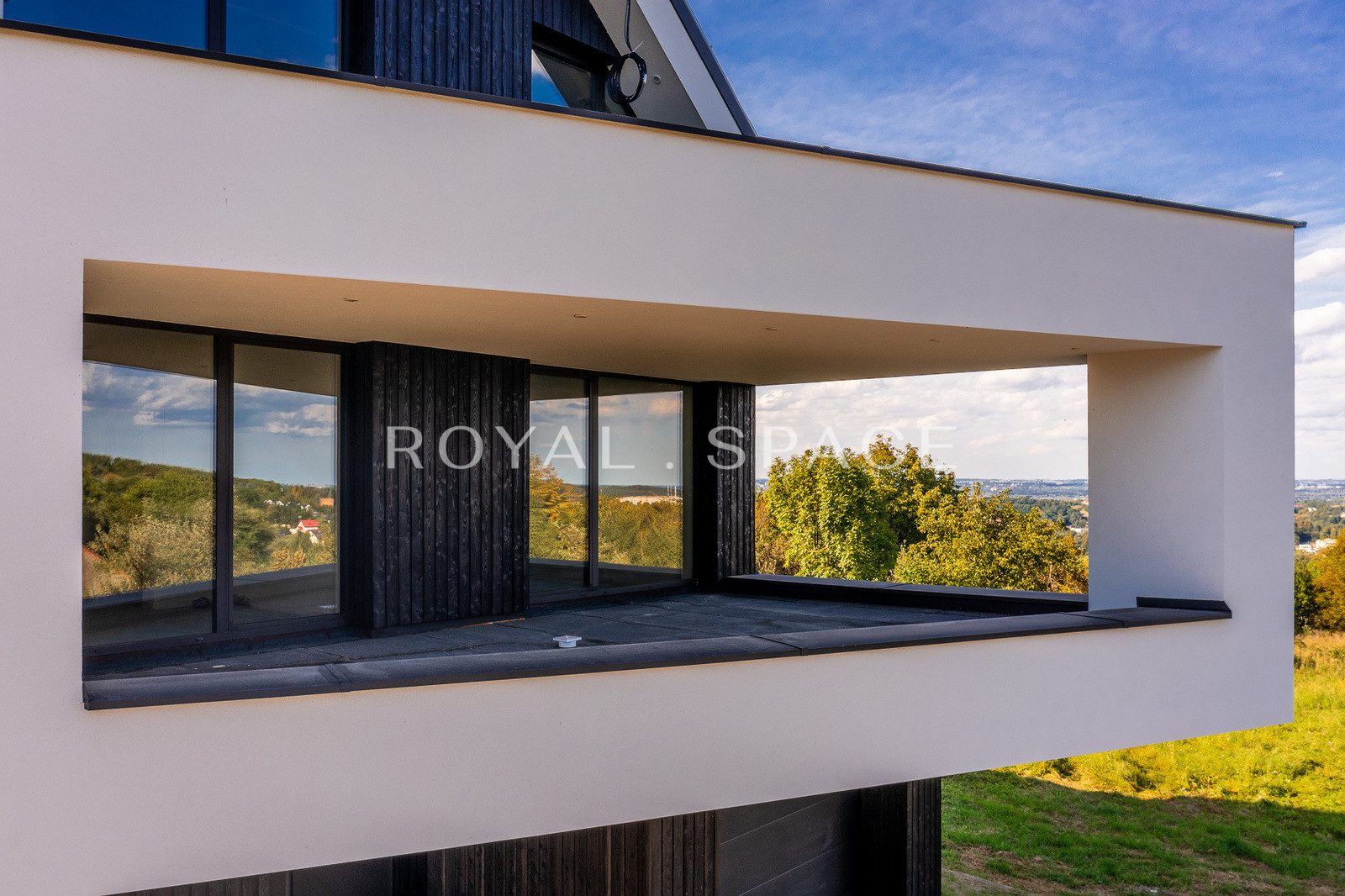 A modern house with large glazing on a hill!